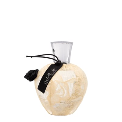Ard Al Zaafaran Daar Al Haneen — Round perfume bottle with lace overlay, black ribbon, rose accent, and silver cap.