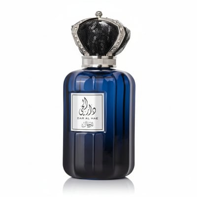 Ard Al Zaafaran Dar Al Hae — Blue glass perfume bottle with a silver crown-like cap adorned with black sequins, on a white
