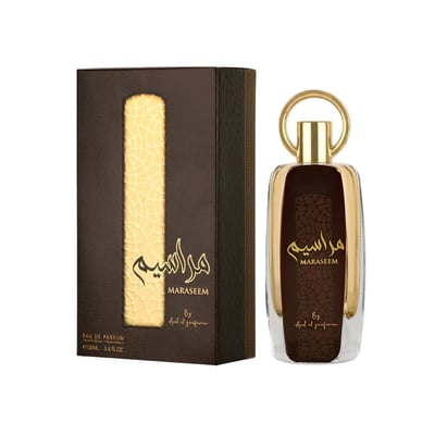 Ard Al Zaafaran Maraseem – Brown textured box with gold pattern next to a clear glass bottle with gold cap and brown