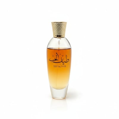 Ard Al Zaafaran Teef Al Hub — Clear glass perfume bottle with gold cap, amber liquid, and Arabic script.