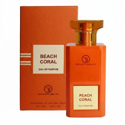 Grandeur Beach Coral by Grandeur 100 ml for Women — Orange perfume bottle and box, with gold cap and label.