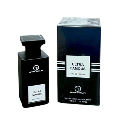 Grandeur Ultra Famous by Grandeur Elite – Black perfume bottle and navy blue box with white label, isolated on white background.