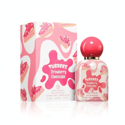 Grandeur Strawberry by Grandeur Tubbees 50ml Woman — A pink and white box with strawberry cheesecake slices and a matching perfume bottle with a red cap, displayed on a reflective white surface.