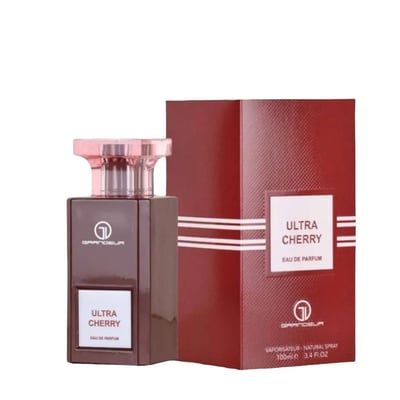 Grandeur Ultra Cherry Eau de Parfum — Dark brown perfume bottle with a pink cap next to its matching red textured box, both featuring white labels with gold accents.