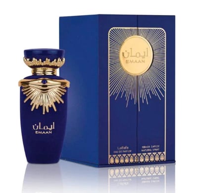 Lattafa Emaan — Blue perfume bottle with gold accents next to a matching blue box with gold sunburst design