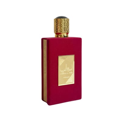 Lattafa Ameerat Al Arab — Red velvet perfume bottle with gold accents and Arabic script on a white background.