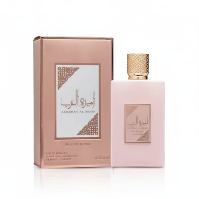 Lattafa Ameerat Al Arab Prive Rose — Pink perfume bottle and matching box with gold cap and Arabic calligraphy details