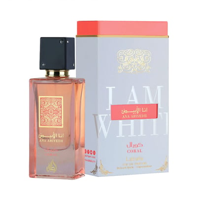 Lattafa Ana Abiyedh Coral — Rectangular glass perfume bottle with coral liquid, gold label, and black cap next to a white