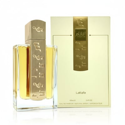 Lattafa Angham by Lattafa EDP 100ml Women — Clear glass perfume bottle with gold musical notes design next to its cream box