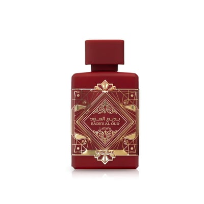 Lattafa Badee Al Oud Sublime — Red perfume bottle with gold geometric design and Arabic text.