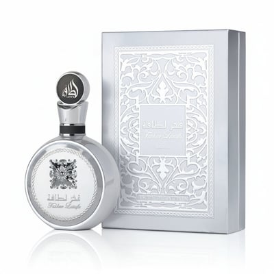 Lattafa Fakhar Platin — Silver round perfume bottle with ornate cap and embossed box with intricate pattern