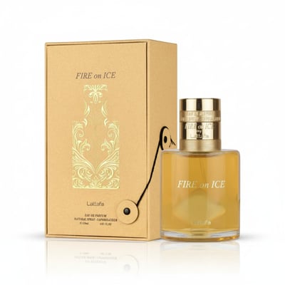Lattafa Fire On Ice — Gold-accented box and clear glass bottle with golden liquid, on a white reflective surface.