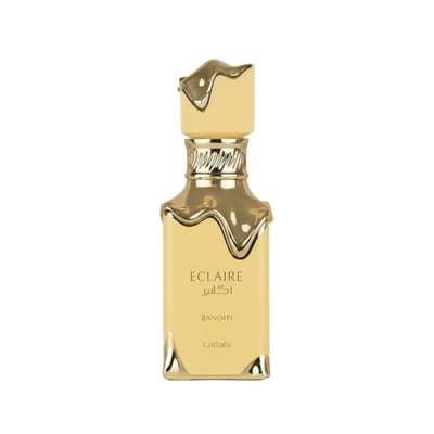 Lattafa Eclaire Banoffi — A tall, rectangular, gold-colored perfume bottle with a unique, wavy gold cap and ornate gold