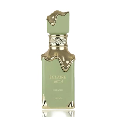 Lattafa Eclaire Pistache — A light green perfume bottle with gold accents and a textured gold cap, isolated on a white