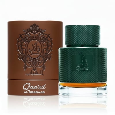 Lattafa Qaaed Al Shabaab by Lattafa 100ml for Men — Green textured perfume bottle with gold accents next to a brown embossed cylindrical box.