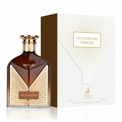 Maison Alhambra Victorioso Heroic — Brown glass perfume bottle with gold accents and a white box with gold sunburst design, isolated on a white background.