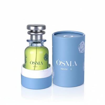 Osma Vanilla S Amber & Musk 75ml EDP — A light green perfume bottle with a silver cap, presented with its blue cylindrical box, on a white background.