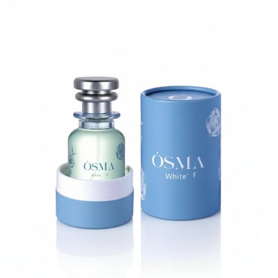 Osma White F Berries & Flowers 75ml EDP — A clear glass perfume bottle with a silver ribbed cap, sitting in a light blue and white holder, next to a light blue cylindrical box with white floral designs.