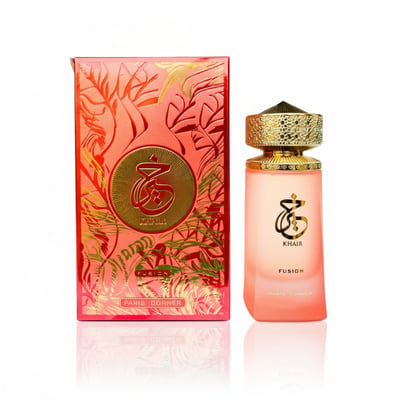 Paris Corner Khair Fusion — Pink gradient perfume bottle with gold ornate cap next to a matching red and gold patterned box, isolated on white.