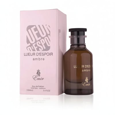 Paris Corner Lueur D Espoir Ambre by Emir Paris Corner 100ml — A pink box and a brown glass perfume bottle with a black cap, set against a white background.