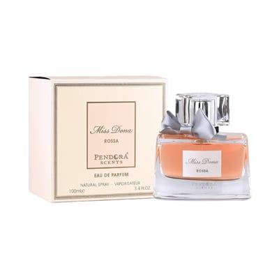 Paris Corner Miss Dona by Paris Corner 100ml Women — A peach-colored perfume bottle with a silver bow and crystal cap, next to its cream-colored box with gold trim.