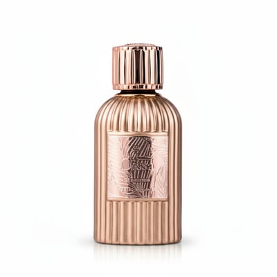 Paris Corner Qissa Delicious by Paris Corner – 100 ml for Women, a rose gold fluted perfume bottle with a textured label featuring tropical leaves.