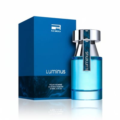 Rue Broca Luminus Pour Homme — Blue glass perfume bottle with silver and blue cap, next to a matching blue box with the Rue Broca logo.