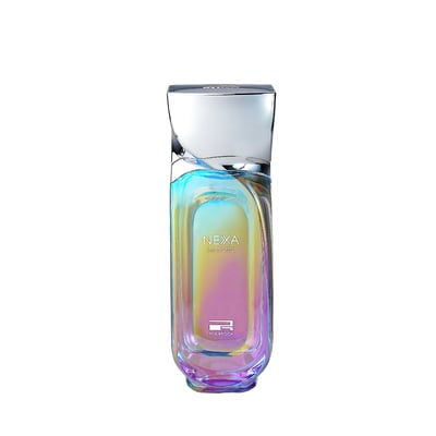 Nexa Immortal by Rue Broca — Iridescent glass perfume bottle with a silver cap, showcasing a gradient of colors from blue to pink.