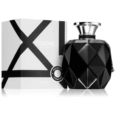 Rue Broca Touche Pour Homme — Black faceted perfume bottle with silver cap next to its white and black geometric patterned box, with a circular Rue Broca logo.