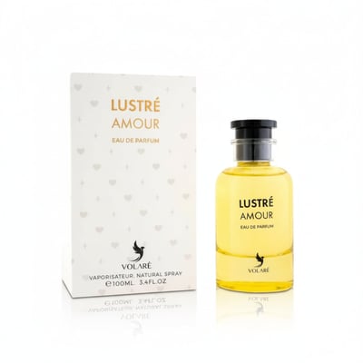 Volare Lustre Amour — Yellow eau de parfum bottle with black cap next to its white box decorated with hearts, 100ml.