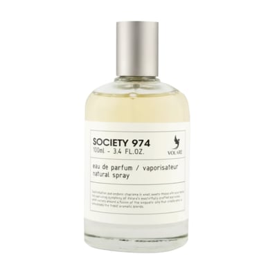 Volare Society 974 — Clear glass perfume bottle with a silver cap, filled with pale yellow liquid, on a white background.