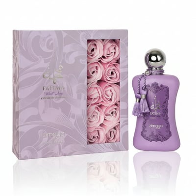 Zimaya Fatima Velvet Love by Zimaya 100ml Extrait Women — A purple perfume bottle with a silver cap and tassels sits next to its matching purple box, which has a window revealing pink rose soaps.
