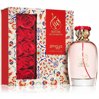 Zimaya Hayam by Zimaya 100ml EDP Women — Pink perfume bottle with gold cap and red accents, next to a gift box featuring red roses and intricate patterns.