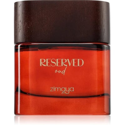 Zimaya Reserved Oud EDP 100 ml Unisex — Close-up of a rectangular glass perfume bottle with a rich orange liquid, featuring gold text "RESERVED oud" and "zimaya" on the front, topped with a dark brown wooden cap.