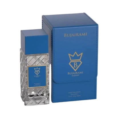 Bujairami Real Deal Fresh Citrus Musk 100ml Extrait — Blue patterned glass perfume bottle with a blue cap, next to a matching blue presentation box with gold accents.