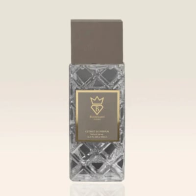 Bujairami World Power Oud Cacao Leather 100ml Extrait — Clear faceted glass bottle with a grey cap and a gold label featuring a crown and 'B' logo, text reads 'EXTRACT DE PARFUM NATURAL SPRAY 3.4 FL. OZ. 100ml'
