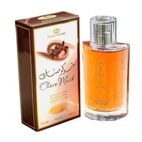 Al Rehab Choco Musk Eau de Parfum — A brown and white box with floral and Arabic script designs sits next to a clear glass perfume bottle filled with amber liquid and a silver cap. | Al Rehab Choco Musk Eau de Parfum — Kotak coklat dan putih dengan rekaan bunga dan tulisan Arab terletak di sebelah botol minyak wangi
