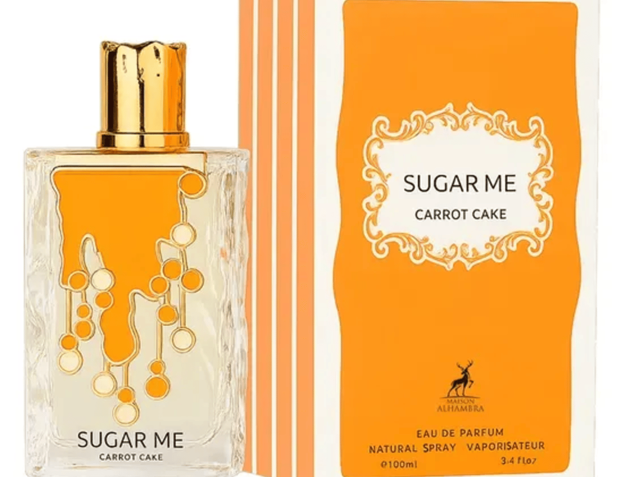 Maison Alhambra Sugar Me Carrot Cake EDP — Botol minyak wangi kaca jernih dengan rekaan titisan oren dan penutup emas, bersebelahan kotak berjalur oren dan putihnya.