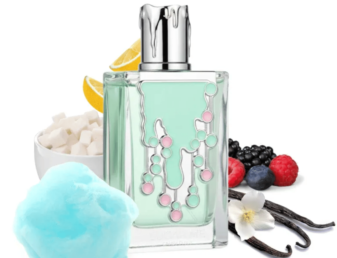 Maison Alhambra Sugar Me Candy Floss by Maison Alhambra 100ml EDP — A clear glass perfume bottle with a mint green liquid and a silver dripping cap, surrounded by cotton candy, sugar cubes, lemon slices, berries, and vanilla beans.