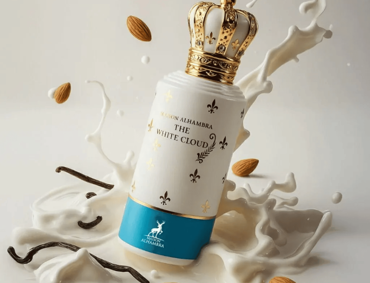 Maison Alhambra The White Cloud by Maison Alhambra 100ml EDP — Botol minyak wangi putih dengan penutup mahkota emas, dikelilingi percikan susu, badam, dan kacang vanila.