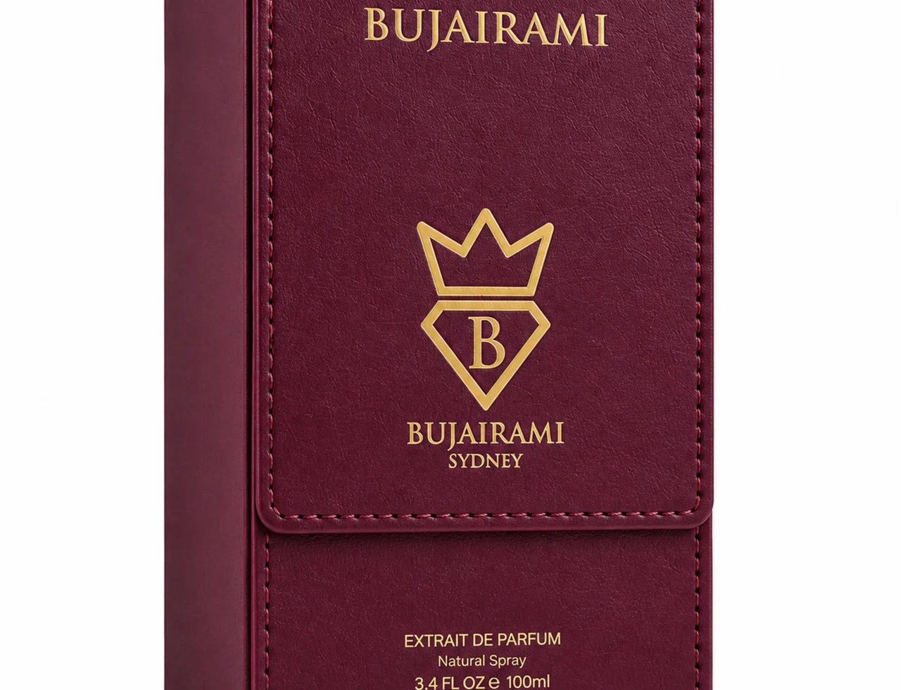 Bujairami Dead Serious by Bujairami 100ml Extrait Unisex — Botol minyak wangi kaca jernih berfaset dengan penutup dan label burgundy, bersebelahan kotak persembahannya yang sepadan di atas permukaan marmar, dengan bunga merah gelap di latar belakang.