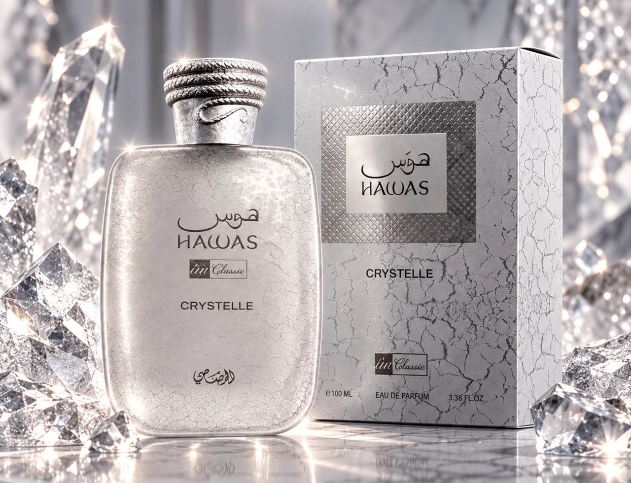 RASASI Hawas Crystelle by Rasasi 100ml EDP — A clear glass perfume bottle with a textured white and silver cracked pattern, a silver rope-like cap, and a matching textured box, surrounded by large clear crystal shards on a marble surface.