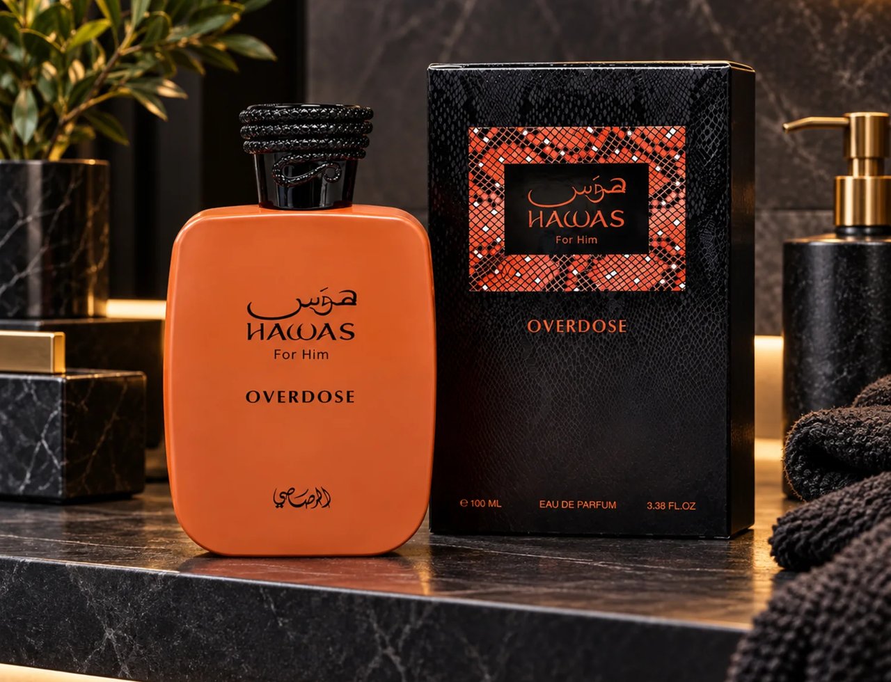 RASASI Hawas Overdose by Rasasi 100ml EDP — Orange perfume bottle and its black textured box with orange accents, displayed on a dark marble countertop with a plant and soap dispenser in the background.