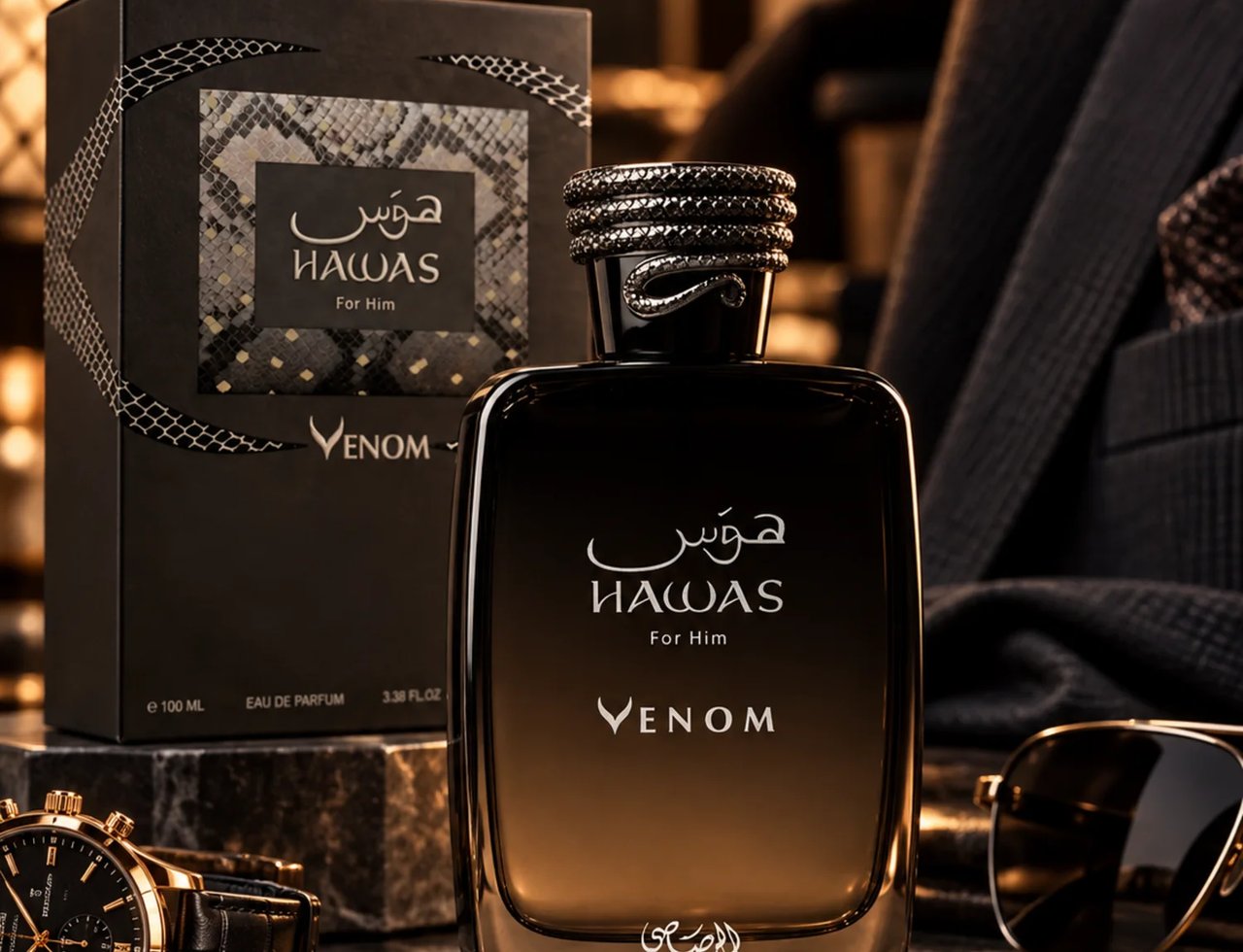 Rasasi Hawas Venom by Rasasi 100ml EDP — Black and gold perfume bottle and box with snake-skin pattern, displayed with a luxury watch and sunglasses on a marble surface.