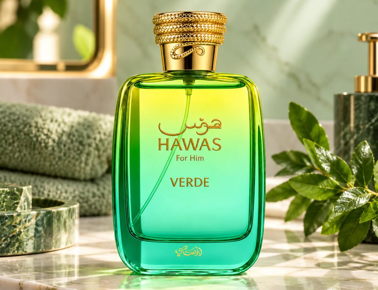 RASASI Hawas Verde by Rasasi 100ml EDP — Botol minyak wangi kaca gradien hijau dan kuning dengan penutup bertekstur emas, diletakkan di atas meja marmar dengan tuala hijau dan daun di latar belakang.