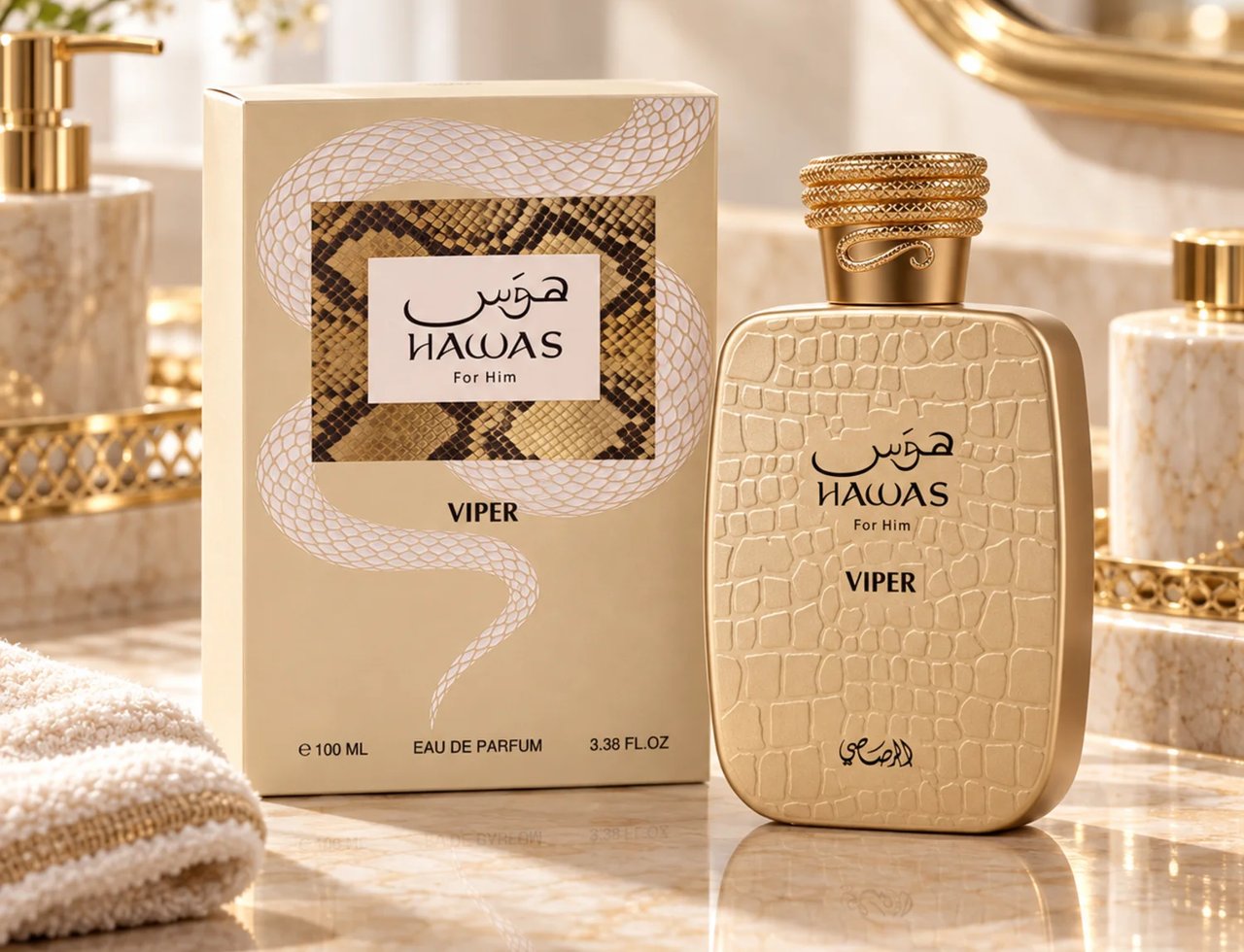 RASASI Hawas Viper by Rasasi 100ml EDP — Gold textured bottle and matching box with snake design, displayed on a marble surface with a gold soap dispenser and towel