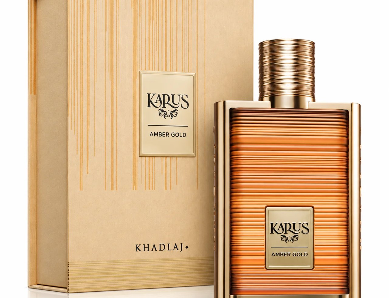 Karus Amber Gold by Khadlaj — Gold-accented perfume bottle with ribbed texture and matching box, featuring "Karus Amber Gold" label.