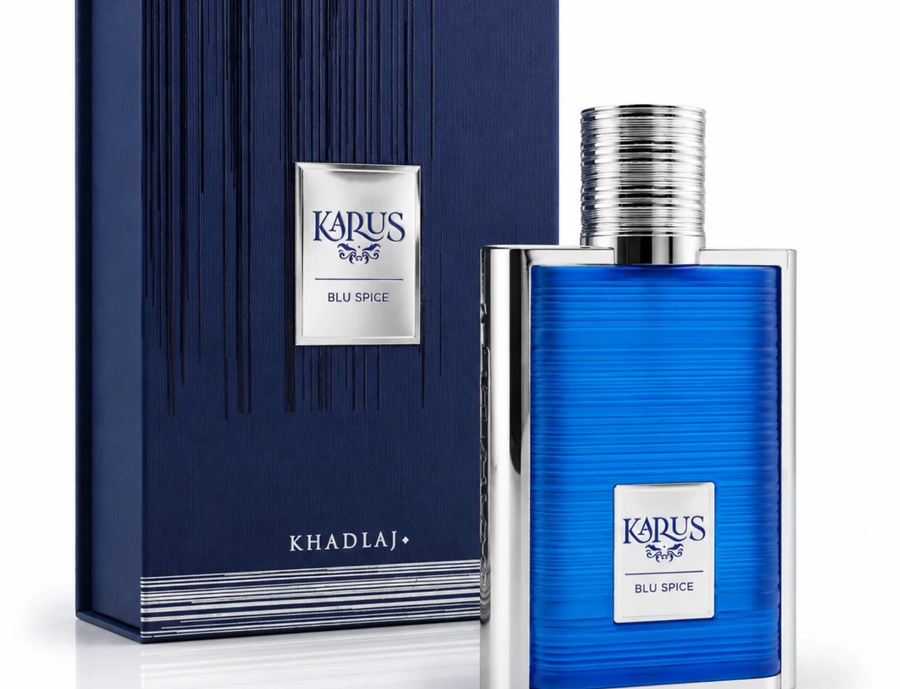 Khadlaj Karus Blu Spice 100ml EDP Men — Blue glass perfume bottle with silver ribbed cap and silver trim, next to a dark blue textured box with silver vertical lines and a silver label.