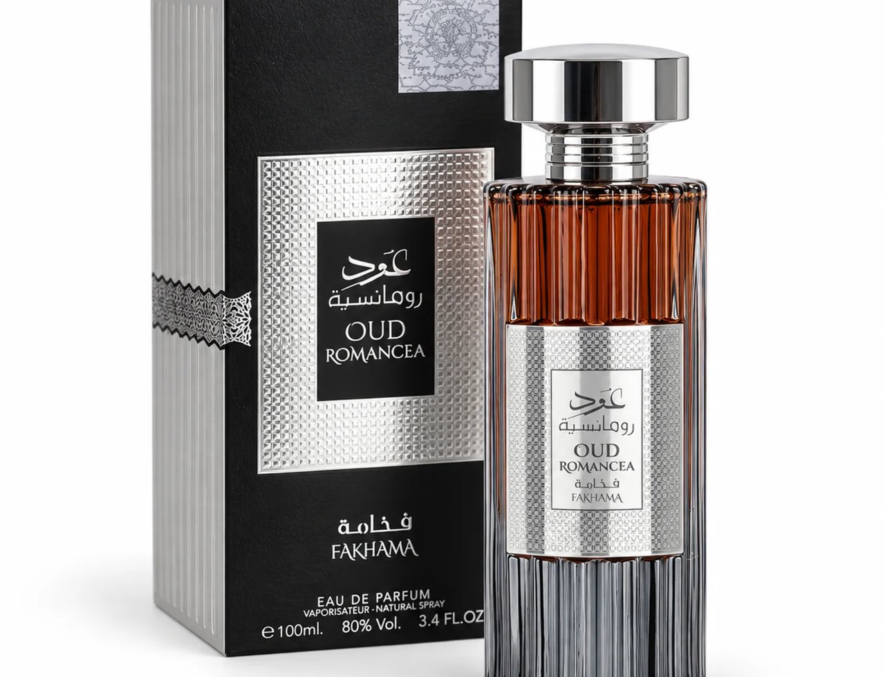 Ard Al Zaafaran Oud Romancea Fakhama — Perfume bottle and box displayed together against a white background. The bottle has a ribbed glass body with amber liquid and a silver cap. The box is black with silver ribbed details and a silver label.