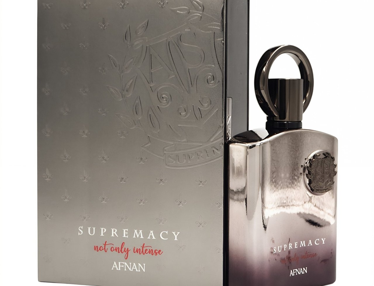 Afnan Supremacy Not Only Intense Extrait 100ml — Silver box with embossed crest and fleur-de-lis patterns next to a metallic